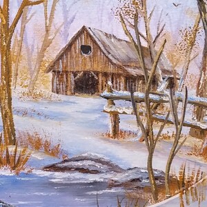 May include: A painting of a wooden barn with a snow-covered roof in a winter scene. The barn is in a forest with bare trees and a small wooden bridge over a frozen stream.