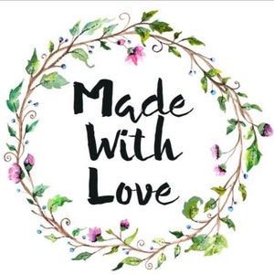 May include: A watercolor illustration of a floral wreath with the text "Made with Love" in black lettering.