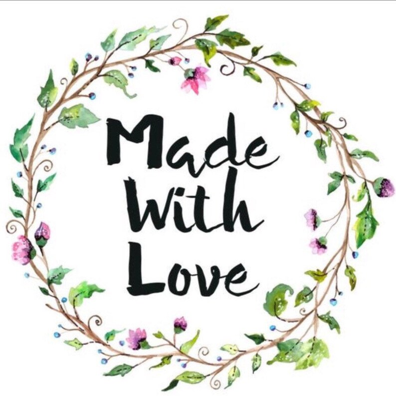 May include: A watercolor illustration of a floral wreath with the text "Made with Love" in black lettering.