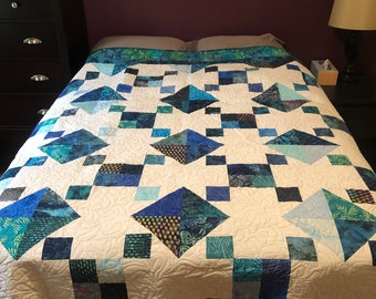 Full size blue and white batik quilt