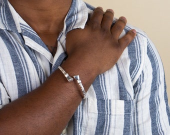 Handmade Sterling Silver West Indian Bangle: Calypso Pattern, Fists Ends