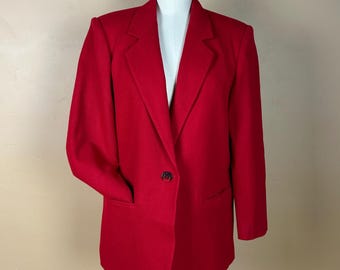 May include: A vibrant red blazer with a classic design. The blazer features a notched lapel, a single-button closure, and a pocket on each side. The garment is displayed on a mannequin.