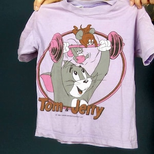 Vintage Tom & Jerry-shirt 1989, maat 104, pastelkleurige snoeppaarsroze grafische print, cartoon kinder T-shirt jaren 80