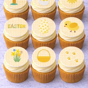 May include: Nine cupcakes with yellow frosting and decorative toppers. The toppers feature Easter-themed designs including an egg hunt sign, a chick, a daisy, the word "EASTER", a dotted egg, a chick, daffodils, a basket, and paw prints.