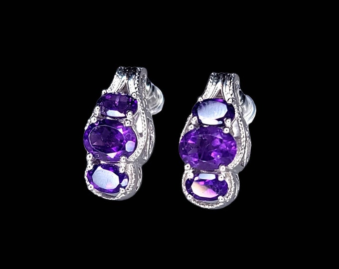 Beautiful Rhodium-Plated 925 Sterling Silver 4.00 CTW Oval 3 Stone Amethyst Earrings.