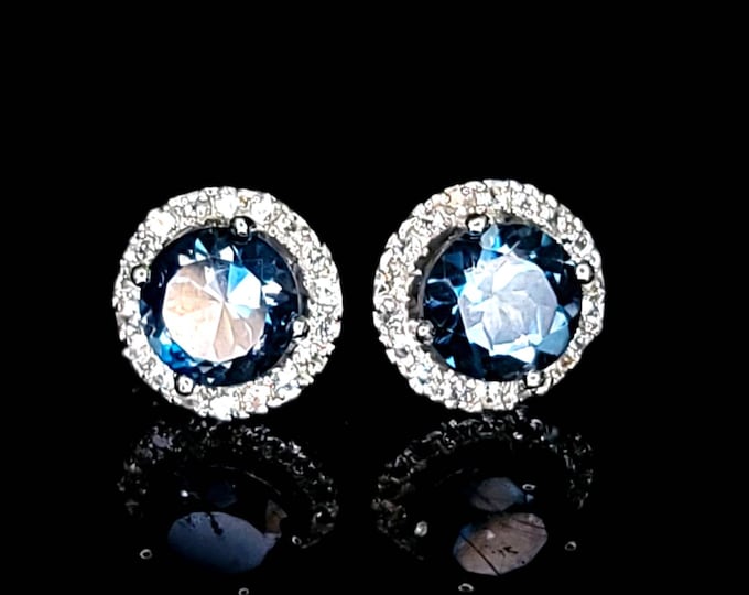 Rhodium-Plated 925 Sterling Silver 5.50 CTW London Blue Topaz Halo Stud Earrings.