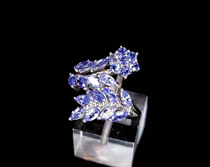 Beautiful Rhodium-Plated 925 Sterling Silver 3.00 CTW Natural Tanzanite Flower Bypass Cocktail Ring.