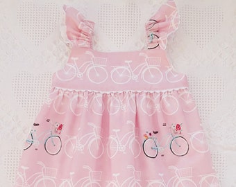 Pink tunic for baby girls,white bicycles, flutter sleeve pink tunic