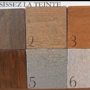 May include: Six wood samples with different stains, numbered 1 through 6.  The samples are arranged in two rows of three.  The top row shows a light brown stain, a medium brown stain, and a reddish brown stain. The bottom row shows a dark brown stain, a gray stain, and a white stain.