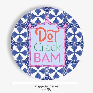 May include: A round appetizer plate with a blue and white geometric pattern. The center features a light blue rectangle framed by a pink bamboo-style border. The text reads DOT in orange, Crack in green, and BAM in pink. It measures 7 inches.
