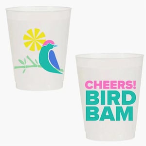 May include: Two translucent plastic cups. One cup features a colorful bird perched on a branch with a yellow sun. The other cup has the words "CHEERS! BIRD BAM" in pink and teal. Ideal for parties and events.