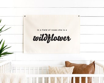 In a field of roses she is a wildflower | canvas flag decor | baby room wall decor | girl nursery sign | boho nursery wall art | D1