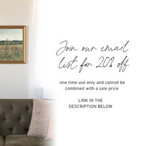 May include: A living room setting featuring a framed landscape painting, a green sofa, and a decorative pillow. The image includes text in cursive: "Join our email list for 20% off". Further text states "one time use only and cannot be combined with a sale price".