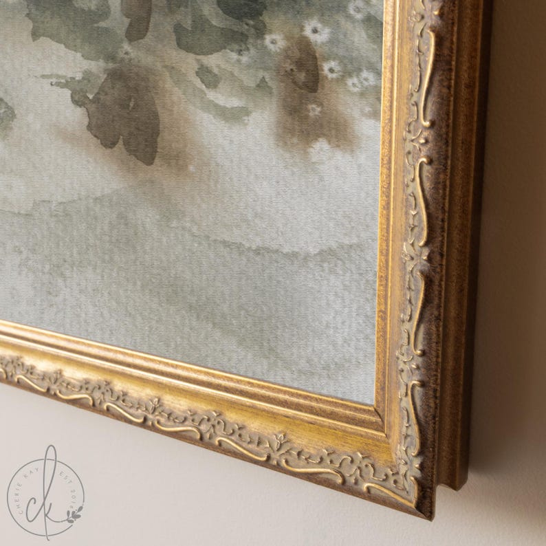 May include: A framed watercolor painting with a gold ornate frame. The artwork features soft, muted tones of green, gray, and brown, suggesting a landscape or abstract floral design. The frame has detailed carvings.