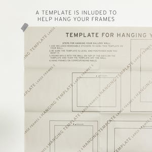May include: A beige paper template for hanging gallery wall frames, featuring black printed outlines of rectangular frames and instructional text. The text reads: A TEMPLATE IS INLUDED TO HELP HANG YOUR FRAMES, TEMPLATE FOR HANGING, and steps for installation.