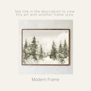 May include: A rectangular wall art print in a dark wood modern frame featuring a watercolor landscape of evergreen trees in shades of green and grey against a light background. Text above reads: See link in the description to view this art with another frame style. Text below reads: Modern Frame.