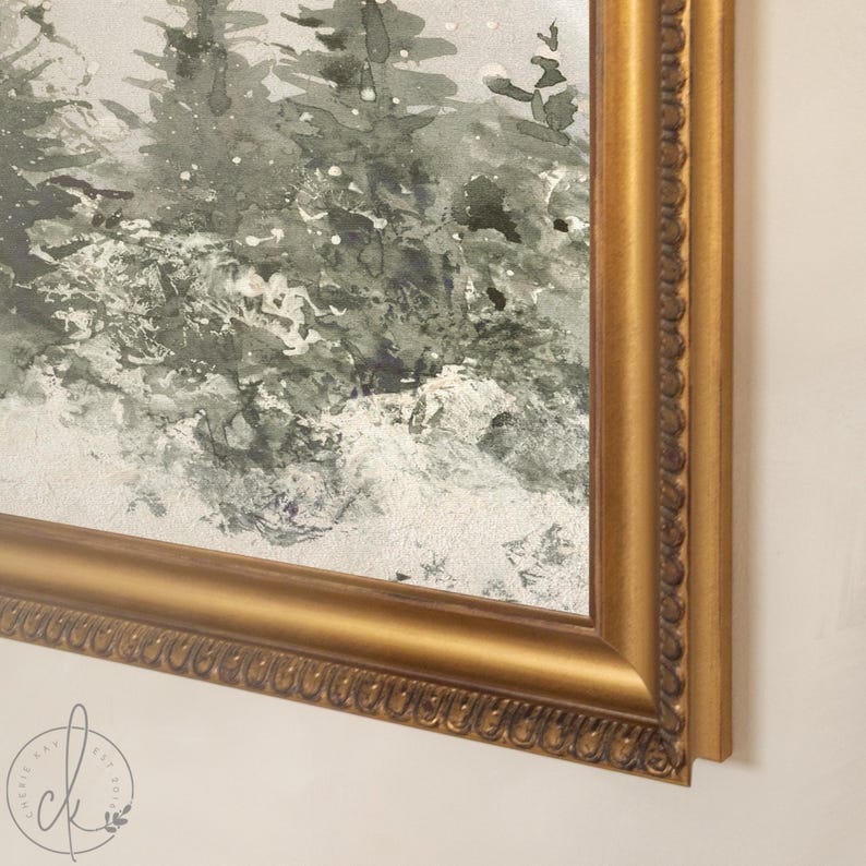 May include: A framed watercolor painting depicting a forest scene with dark green pine trees and white snow. The artwork is enclosed in a decorative gold-toned frame with a textured, beaded inner border, showcasing a winter landscape.