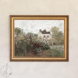 May include: A framed landscape painting depicting a house amidst vibrant flowers and foliage. The artwork is presented in a gold ornate frame, with a soft, muted colour palette, creating a vintage feel.