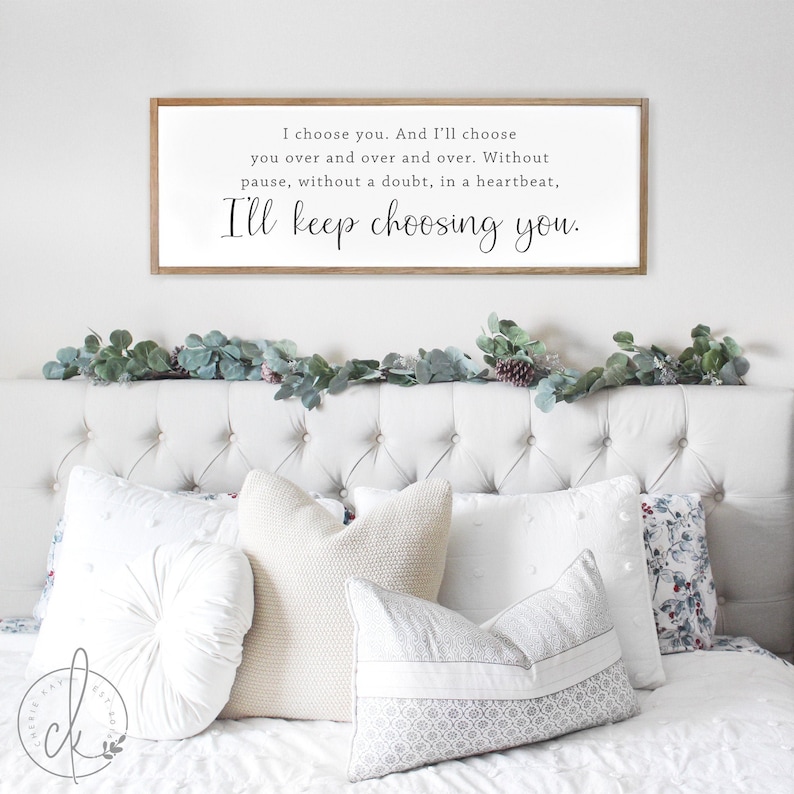 May include: A white wooden sign with black text that reads "I choose you. And I'll choose you over and over and over. Without pause, without a doubt, in a heartbeat, I'll keep choosing you."