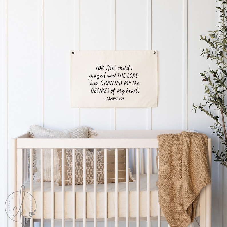 Christian nursery decor canvas flag with 1 Samuel 1:27 verse on a cream canvas