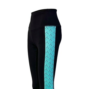 May include: Black leggings with a turquoise side panel featuring a geometric pattern of crossed lines and dots.