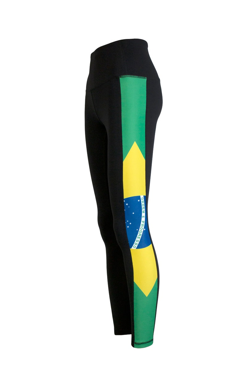May include: Black leggings with a green, yellow, and blue stripe down the side featuring the Brazilian flag with the text "ORDEM E PROGRESSO".