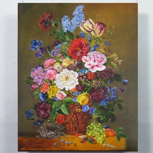 May include: A still life painting of a vase filled with a variety of colorful flowers, including roses, tulips, and lilies. The vase is brown and has a rustic texture. There is a bird's nest with eggs at the bottom of the painting, along with grapes and an apple.