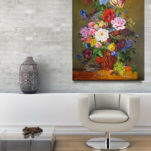 May include: A still life painting of a vase filled with a variety of colorful flowers, including roses, lilies, and tulips. The vase is brown and has a rustic appearance. There is a bird's nest with eggs in the foreground, and a bowl of fruit on the table.