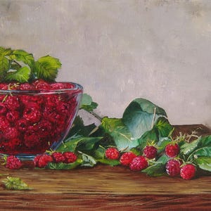 May include: An oil painting of a clear glass bowl filled with bright red raspberries and green leaves. Several loose raspberries and leafy stems are scattered on the dark wooden surface next to the bowl, set against a neutral gray background.