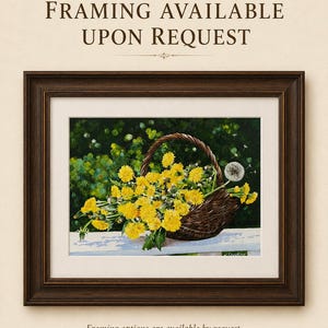 May include: A framed painting depicting a brown woven basket filled with bright yellow dandelion flowers and one white dandelion seed head. The text "FRAMING AVAILABLE UPON REQUEST" appears at the top and bottom of the image in dark brown font.