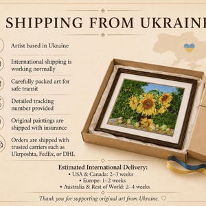 May include: A framed painting of yellow sunflowers and green apples in a brown cardboard gift box with a tan lid and a blue and yellow ribbon. The painting features a vibrant floral arrangement against a green background with scattered fruit.