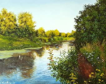 May include: An oil painting depicting a calm river flowing through a lush landscape with vibrant green trees, yellow foliage, and wildflowers along the muddy banks. The water reflects the bright sky and surrounding greenery, with the artist signature J. Shayking '20 visible in the bottom left corner.