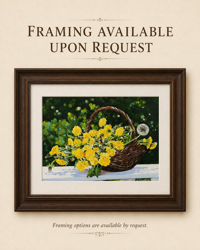 May include: A framed painting of a dark brown woven basket filled with bright yellow dandelion flowers and one white dandelion seed head, set against a dark green background. The text "FRAMING AVAILABLE UPON REQUEST" appears above the frame.