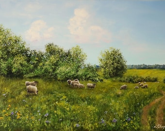 May include: An oil painting depicting a lush green meadow with a dirt path winding through the grass. A small flock of white sheep grazes near a line of green trees under a light blue sky with soft white clouds. The artist signature N. Shoykina is visible.