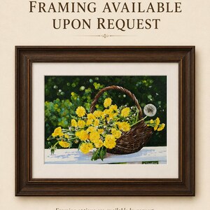 May include: A framed painting depicting a brown woven basket filled with bright yellow dandelion flowers and one white dandelion seed head. The text "FRAMING AVAILABLE UPON REQUEST" appears at the top and bottom of the image in dark brown font.