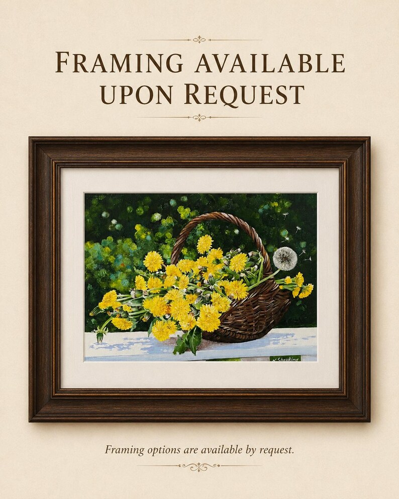 May include: A framed painting depicting a brown woven basket filled with bright yellow dandelion flowers and one white dandelion seed head. The text "FRAMING AVAILABLE UPON REQUEST" appears at the top and bottom of the image in dark brown font.