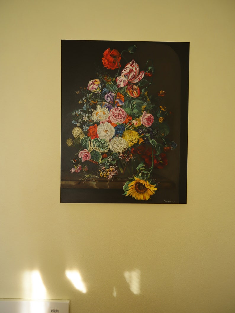 May include: A framed floral still life painting featuring a vibrant bouquet of flowers. The arrangement includes red poppies, white roses, and a large yellow sunflower. The artwork is set against a dark background.