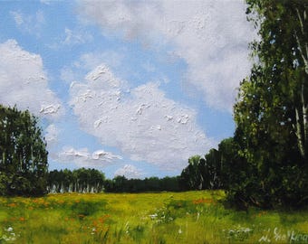 May include: Oil painting of a sunny landscape with a bright blue sky and puffy white clouds. A green field of grass and wildflowers is in the foreground, with trees on either side and in the distance. The artist's signature is in the bottom right corner.