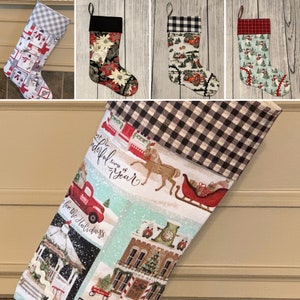 May include: A set of five Christmas stockings with various holiday themes. The stockings are made of fabric and feature different patterns, including plaid, floral, and winter scenes. The stockings are all approximately 18 inches long.