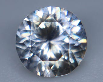 Natural Ceylon White Sapphire: 0.60 Carat Round Cut Gemstone