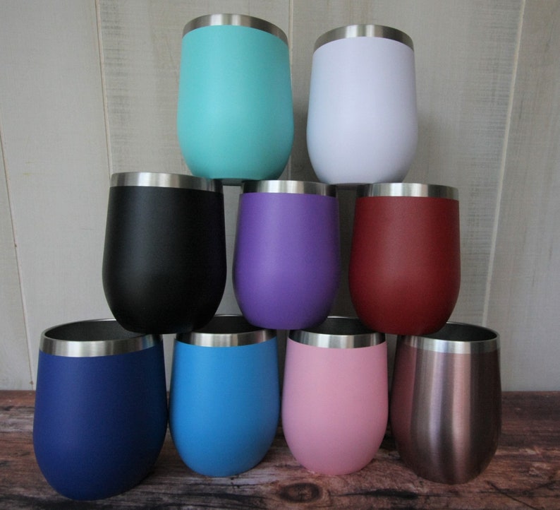 May include: Set of nine stainless steel wine tumblers in various colors, including teal, white, black, purple, red, blue, light blue, pink, and rose gold.