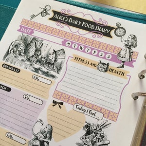 May include: A pink and yellow daily food diary planner with a whimsical Alice in Wonderland theme. The planner features illustrations of Alice, the Mad Hatter, and the Cheshire Cat. The planner has sections for breakfast, lunch, dinner, and snacks, as well as a section for fitness and health. The planner also includes a section for tracking daily feelings.