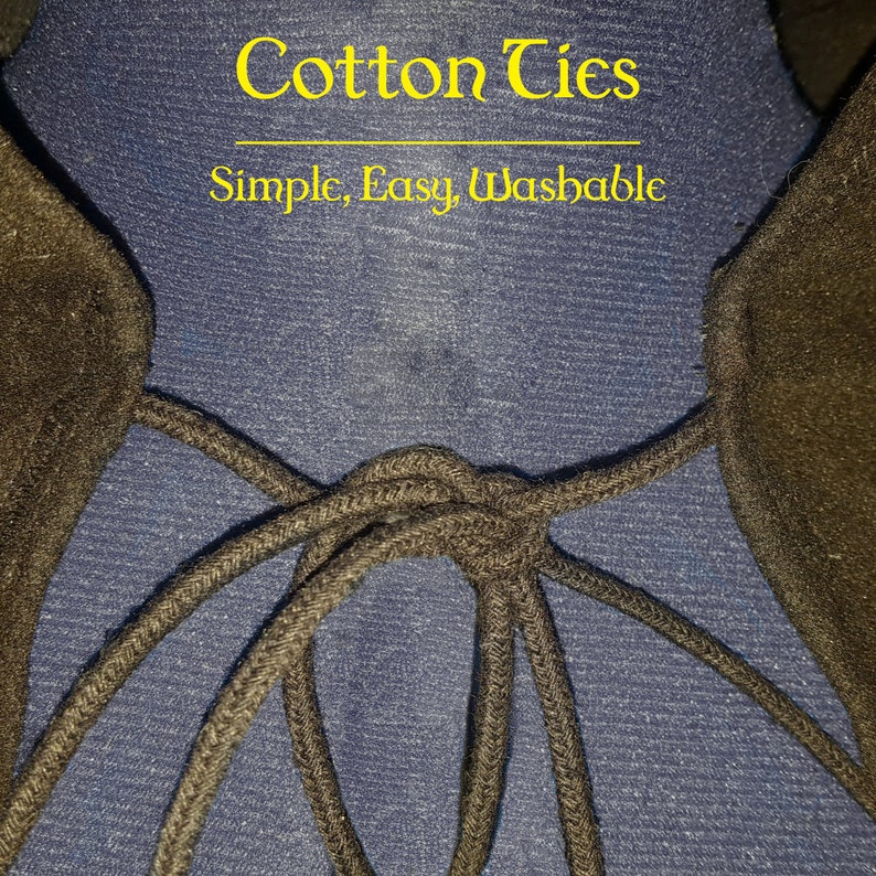 May include: Close-up of black cotton ties tied together on a blue fabric background. The text "Cotton Ties" and "Simple, Easy, Washable" is printed above the ties.