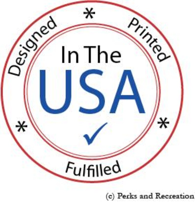 May include: Red and white circular stamp with the text "Designed", "In The USA", "Printed", "Fulfilled", and a checkmark. The text "In The USA" is in blue and the rest of the text is in black.