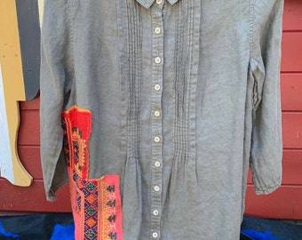 Khaki Linen button up with front pleating, and collaged Vintage textiles fromThai hilltribes known as Hmong. Hand ruined by Sue, original!