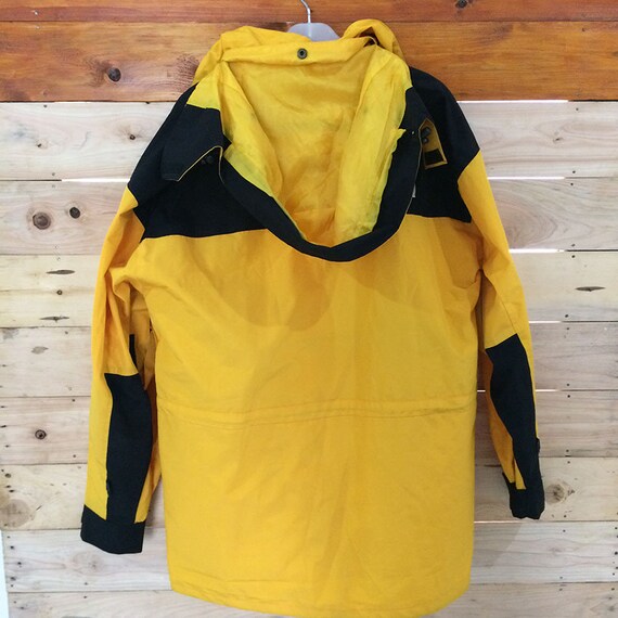 north face black yellow jacket