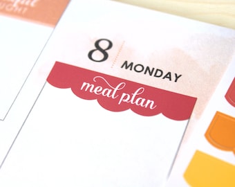 May include: A close-up of a planner page with the date "8" and "MONDAY" in black. A red scalloped banner with the words "meal plan" in white script is at the bottom. The background has a watercolor wash.