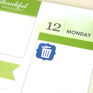 May include: A blue trash can icon on a white background with a green and white striped border. The text "12 MONDAY" is visible above the icon.