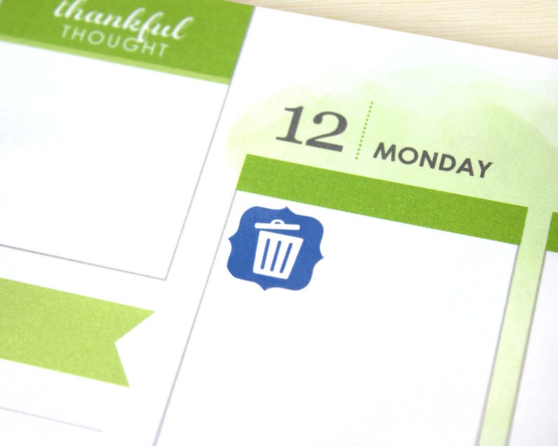 May include: A blue trash can icon on a white background with a green and white striped border. The text "12 MONDAY" is visible above the icon.