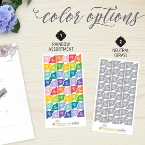 May include: Two sticker sheets with color options: rainbow assortment and neutral gray. The rainbow sheet features colorful flag-shaped stickers. The gray sheet has gray flag-shaped stickers. The text "color options" is at the top.